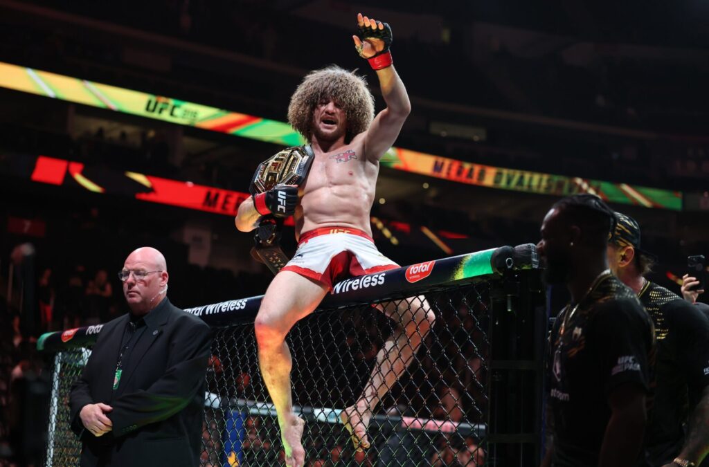 Merab Dvalishvili (red gloves) reacts after defeating Sean O’Malley (not pictured) in a bantamweight title fight during UFC 316