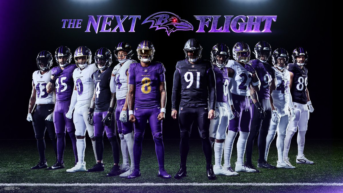 -  Lineup of Baltimore Ravens players in purple and white uniforms under a purple-lit banner that reads 'The Next Flight'.